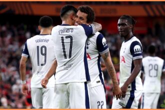 Cristiano Romero celebrating with Brennan Johnson