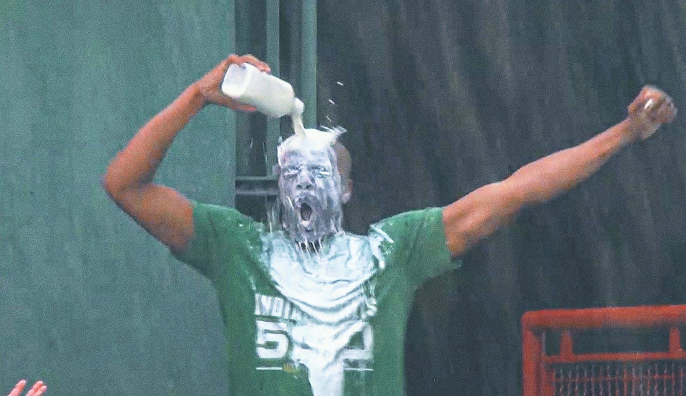 Indy 500 Fever? Baseball fans pour themselves milk to celebrate their home run