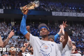 Shai Gilgeous-Alexander of the Oklahoma City Thunder is awarded the Earvin "Magic" Johnson Trophy for the NBA Western Conference Finals Most Valuable Player.