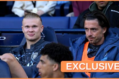 Erling Haaland and Jack Grealish on the Manchester City bench