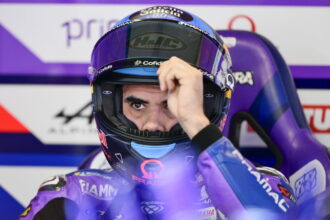 A finger pointing to a round MotoGP rider that is likely to be replaced in 2026