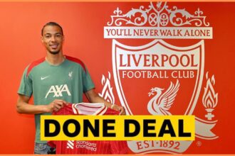 Hugo Ekitike posing with his Liverpool shirt