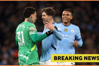 Ederson, John Stones, and Manuel Akanji celebrate