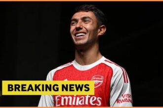 Martin Zubimendi poses in his Arsenal kit, plus breaking news banner