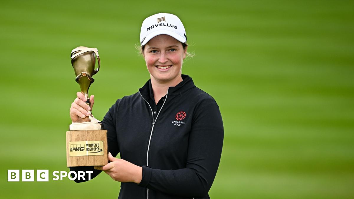 Lottie Woad poses with the Women's Irish Open trophy