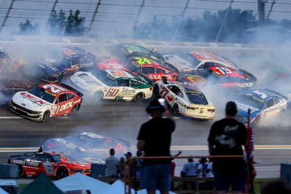 NASCAR stops the Atlanta Cup race after a major crash collects half of the field
