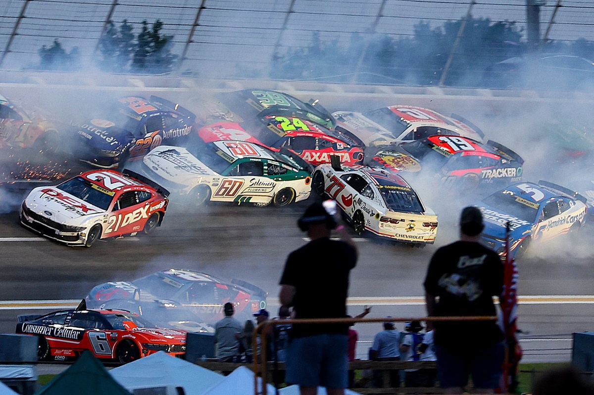 NASCAR stops the Atlanta Cup race after a major crash collects half of the field
