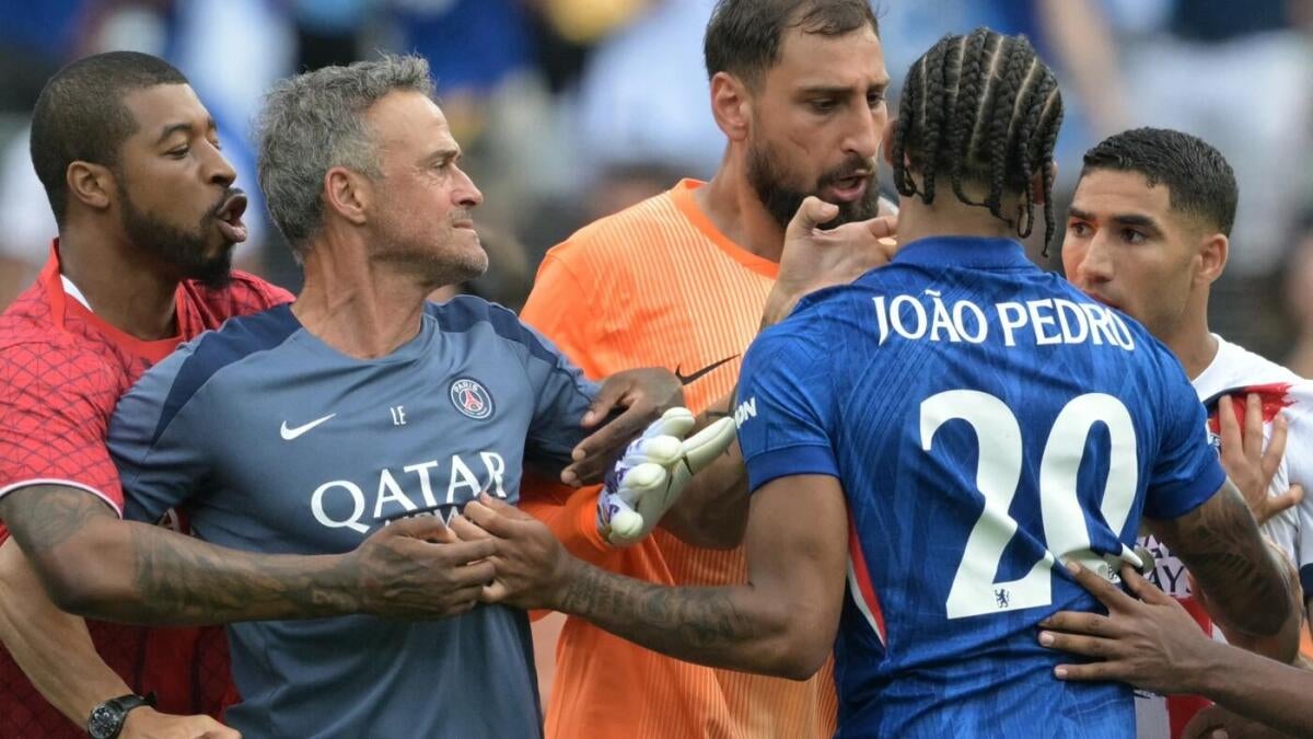 PSG manager Luis Enrique is involved in an argument with Chelsea's João Pedro after the Club World Cup final