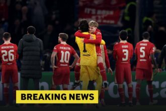 Alisson and Harvey Elliott celebrate at the end of Liverpool