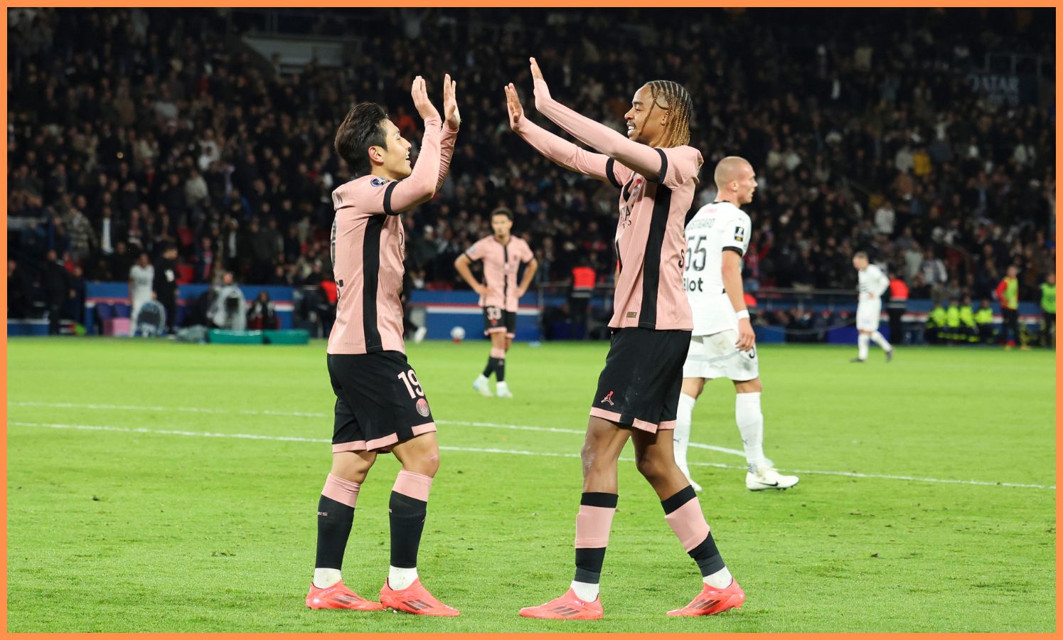 Bradley Barcola celebrates with PSG teammate Lee Kang-in