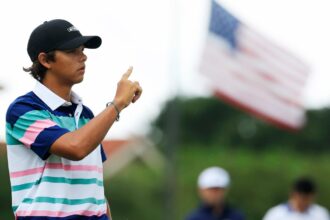 How did Charlie Woods get carried away in the first round of the junior player?