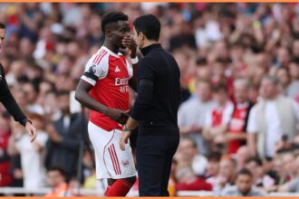 Bukayo Saka and Mikel Arteta