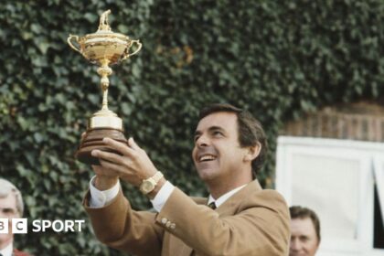 Europe captain Tony Jacklin raises the Ryder Cup after winning for the first time at The Belfry in 1985