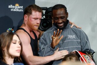 Terrence Crawford speaks with Canelo Alvarez after their undisputed super middleweight title fight in September 2025.