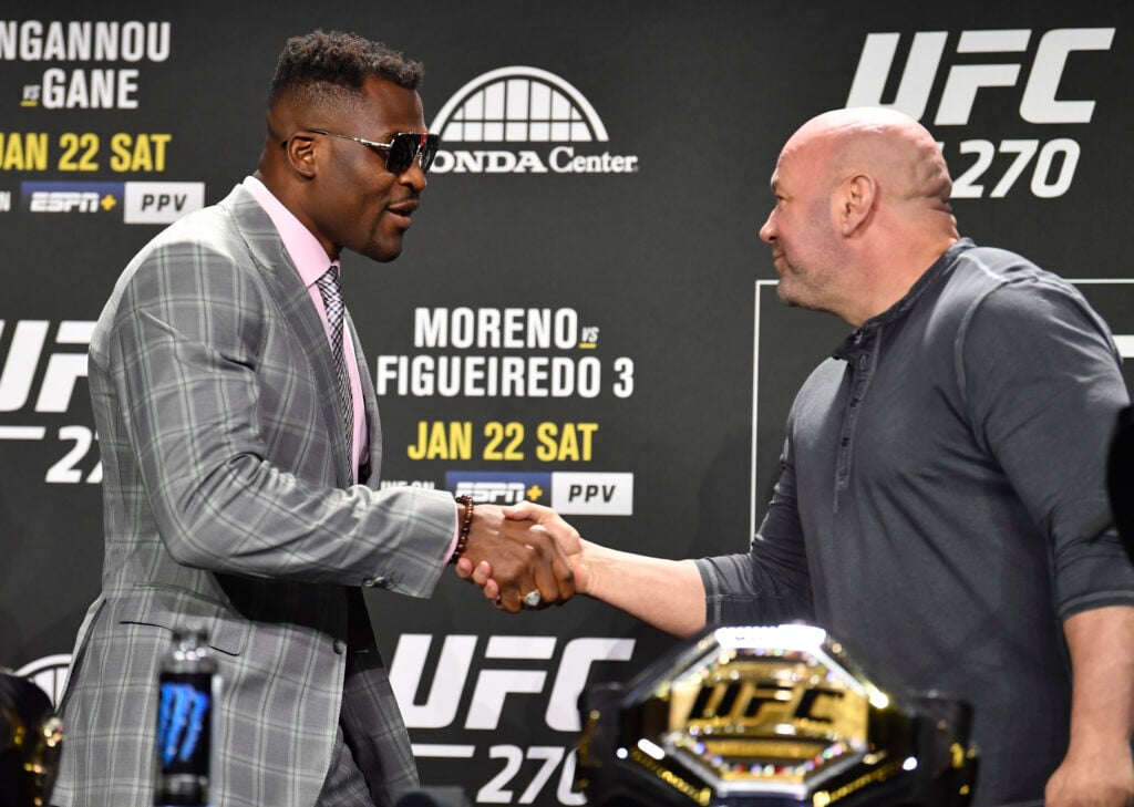 Francis Ngannou shakes hands with Dana White at UFC 270 press conference