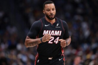 #24 Norman Powell of the Miami Heat runs the floor during the first quarter of the game against the Denver Nuggets at Ball Arena on November 5th.