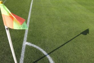 Coach apologizes for anti-gay slur over pink shirt