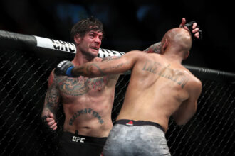 CM Punk and Mike Jackson exchange punches during their UFC 225 match