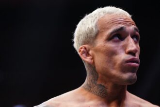 Charles Oliveira enters the Octagon ahead of his lightweight title fight against Ilia Topuria at UFC 317 in June 2025.