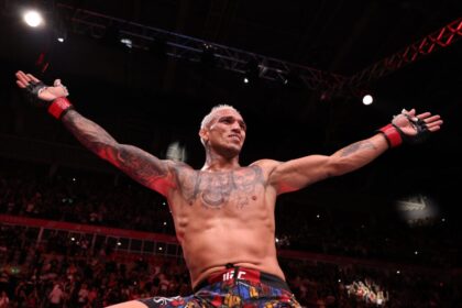 Charles Oliveira celebrates his victory over Mateusz Gamlot at UFC Rio in October 2025.