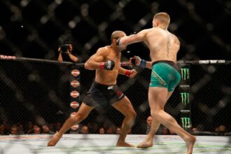 Conor McGregor knocks out Jose Aldo with a left hand