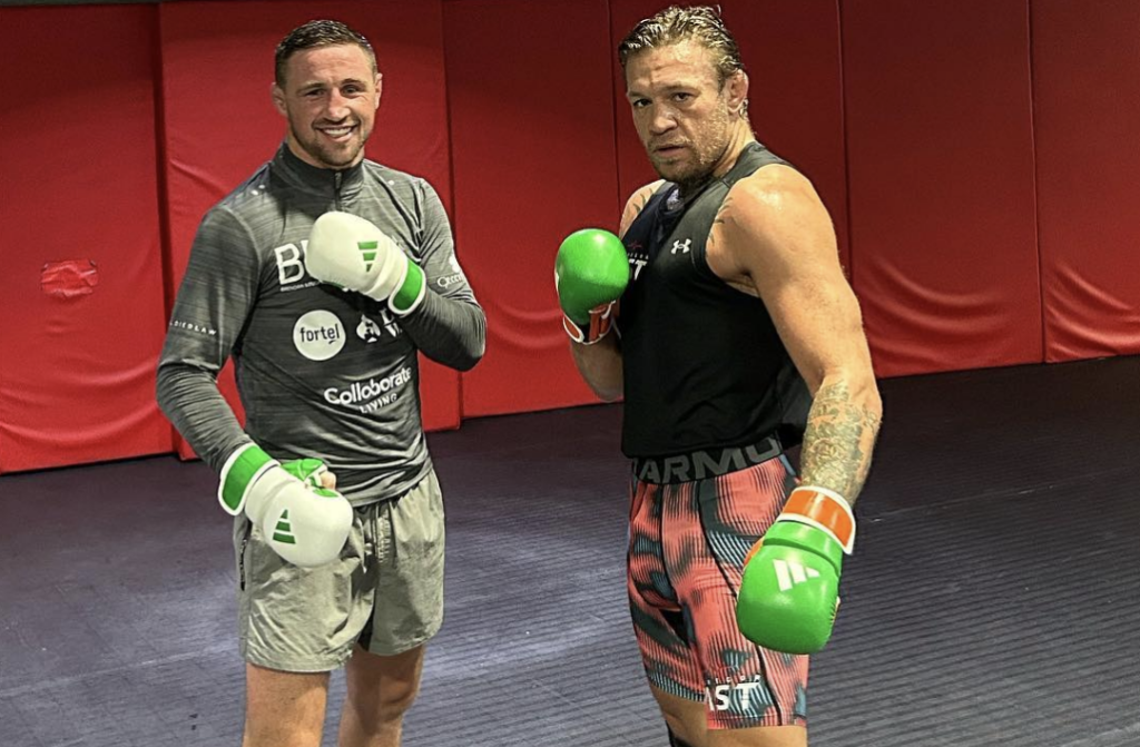 Brendan Loughnane (left) poses after a training session with Conor McGregor (right)