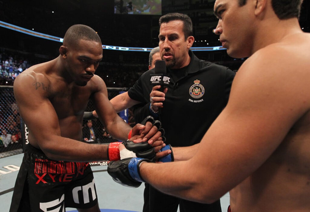 Jon Jones and Lyoto Machida touch gloves during the main event of UFC 140