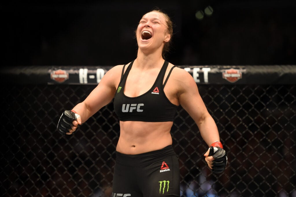 Ronda Rousey celebrates defeating Cat Zingano at UFC 184
