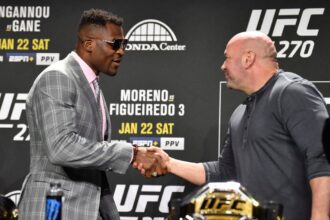 Francis Ngannou and Dana White shake hands at the UFC 270 press conference