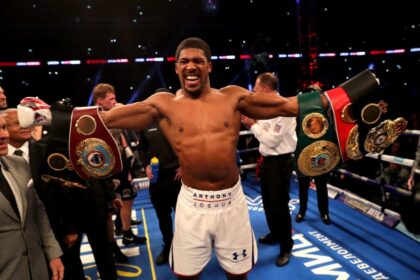Anthony Joshua celebrates in the ring after his heavyweight title fight against Alexander Povetkin in September 2018.