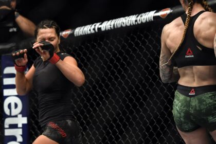 Cat Zingano winces in pain after suffering eye damage during fight against Megan Anderson at UFC 232