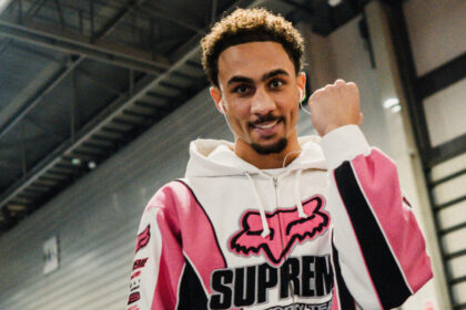 Ben Whittaker stares at the camera and pumps his fist backstage