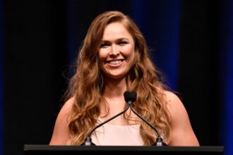 Ronda Rousey speaks at the UFC Hall of Fame induction ceremony.