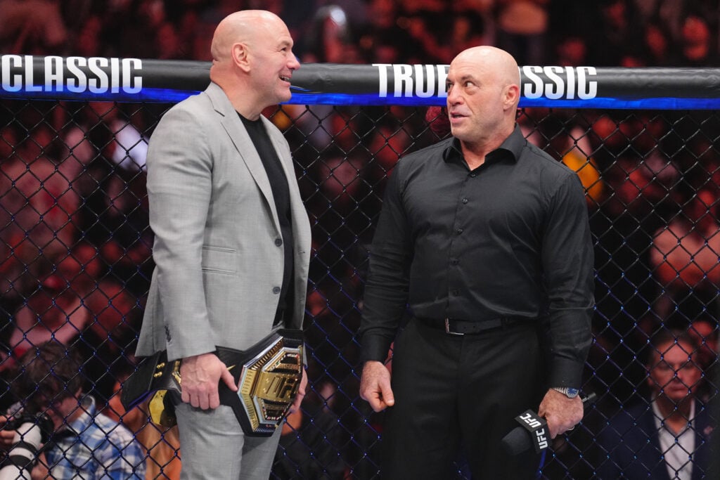 Joe Rogan and Dana White speak in the Octagon after knockout of Ilia Topuria at UFC 317