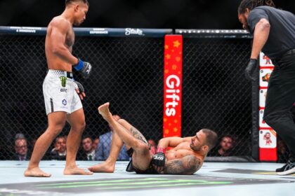 Alexandre Pantoja is injured and Joshua Vann stands over him