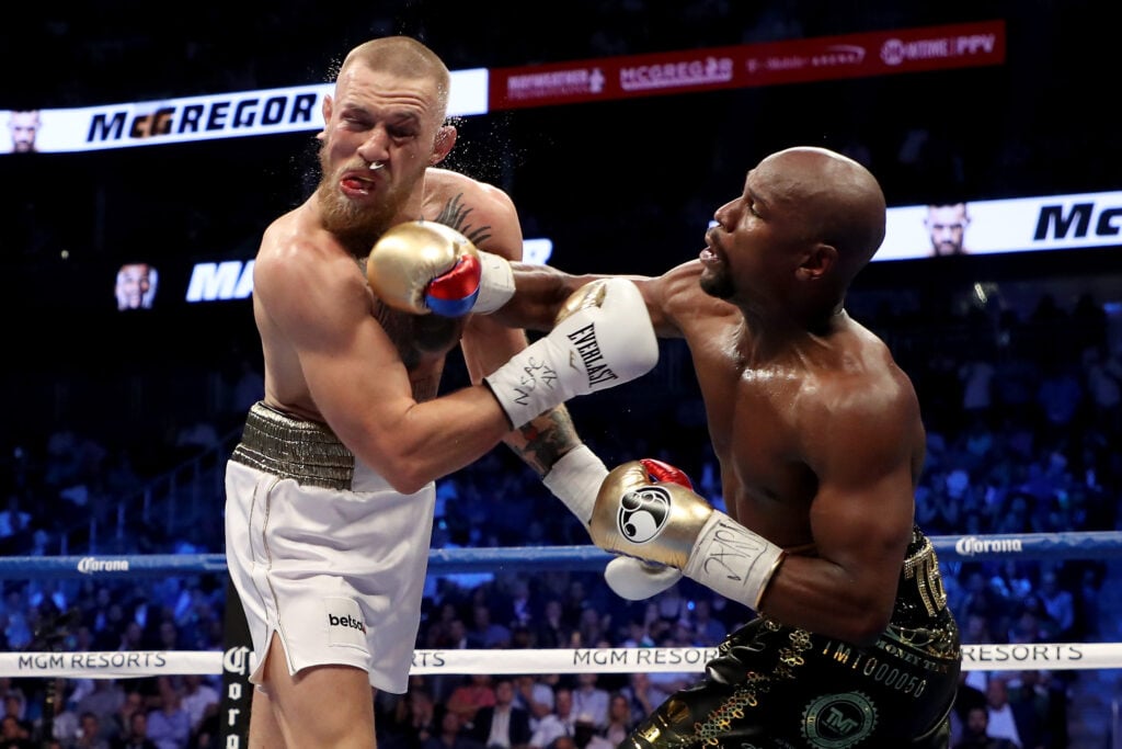 Floyd Mayweather hits Conor McGregor with a right hand