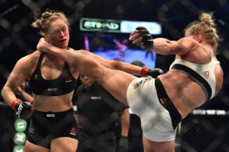 Holly Holm kicks Ronda Rousey in the head at UFC 193