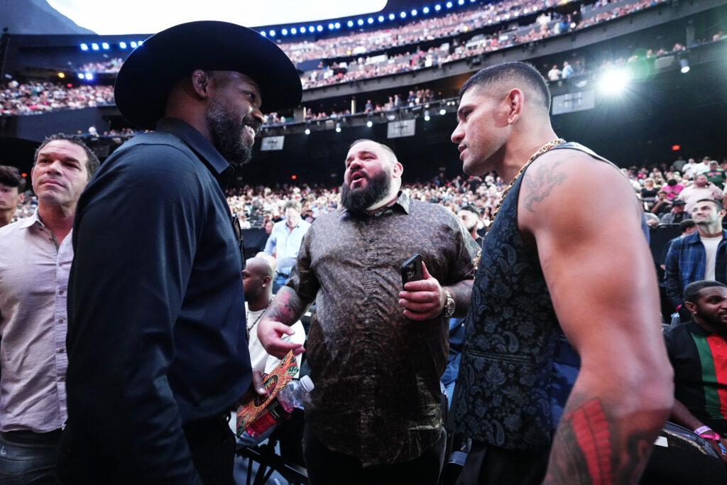 Jon Jones and Alex Pereira interact while attending UFC 306