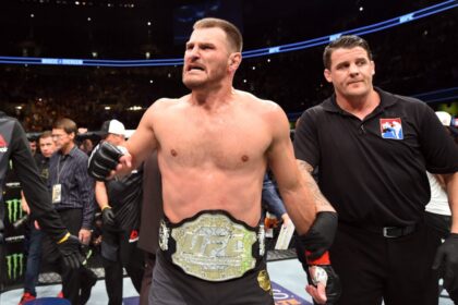 Stipe Miocic celebrates after stopping Alistair Overeem at UFC 203