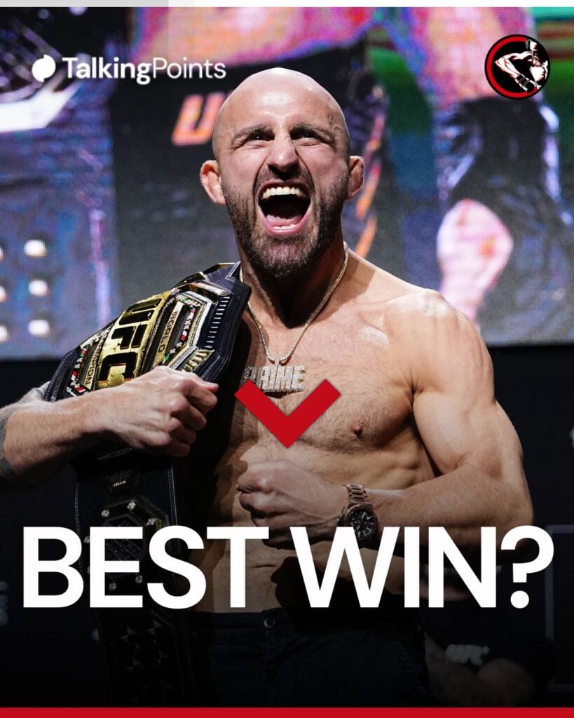 Alexander Volkanovski poses on stage during the UFC 325 press conference