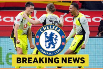 Aaron Anselmino celebrates with his Borussia Dortmund teammates