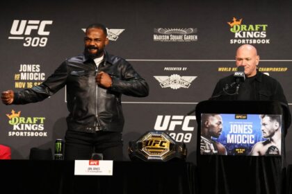 Jon Jones thanks the crowd with UFC CEO Dana White at the UFC 309 press conference