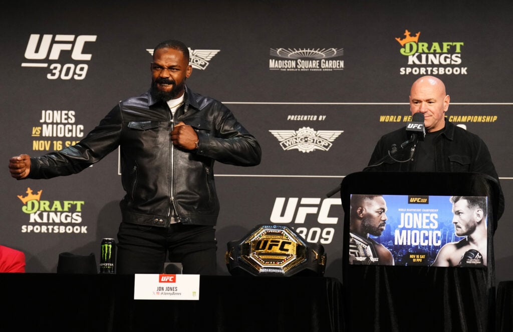 Jon Jones thanks the crowd with UFC CEO Dana White at the UFC 309 press conference