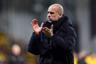 Pep Guardiola, Manager of Manchester City, reacts as he applauds the fans after the UEFA Champions League 2025/26 League Phase MD7 match between FK Bodo/Glimt and Manchester City at Aspmyra Stadion
