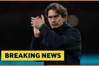 Tottenham manager Thomas Frank applauding fans with overlay of Breaking News