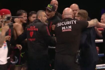 Boxer storms the ring and kicks fighter to celebrate world title 12th round KO win