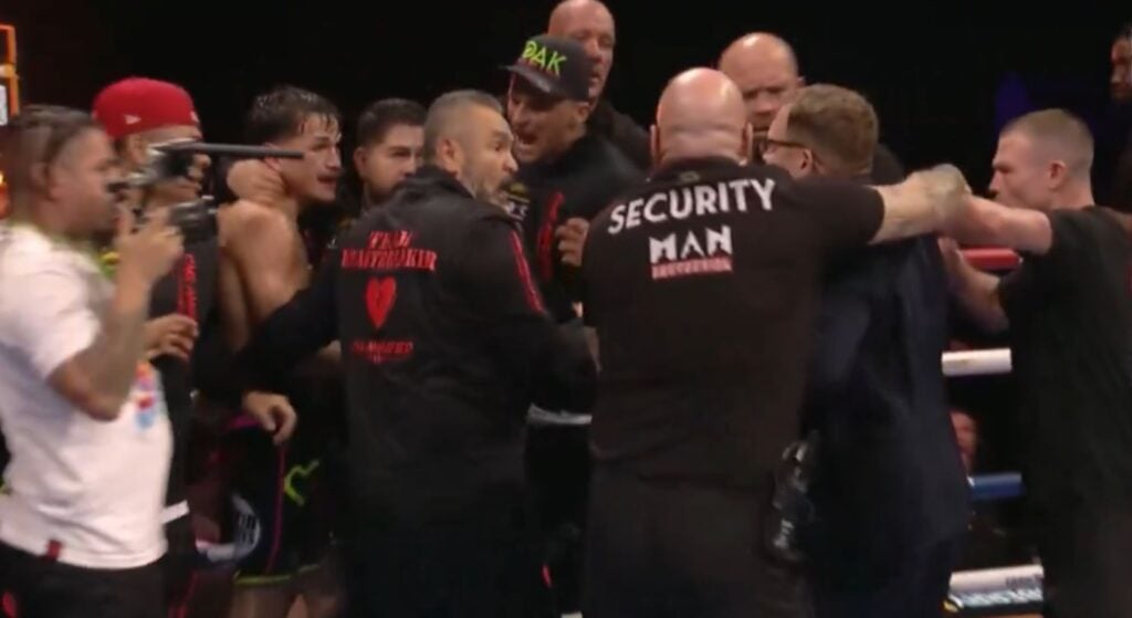 Boxer storms the ring and kicks fighter to celebrate world title 12th round KO win