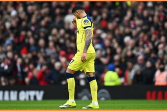Cristian Romero walking off after his red card for Tottenham vs Manchester United