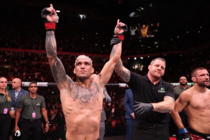 Charles Oliveira raises his hand on Mateusz Gamrot at UFC Rio