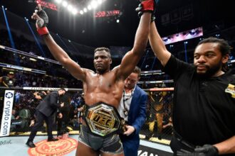 Francis Ngannou celebrates defeating Cyril Gane at UFC 270